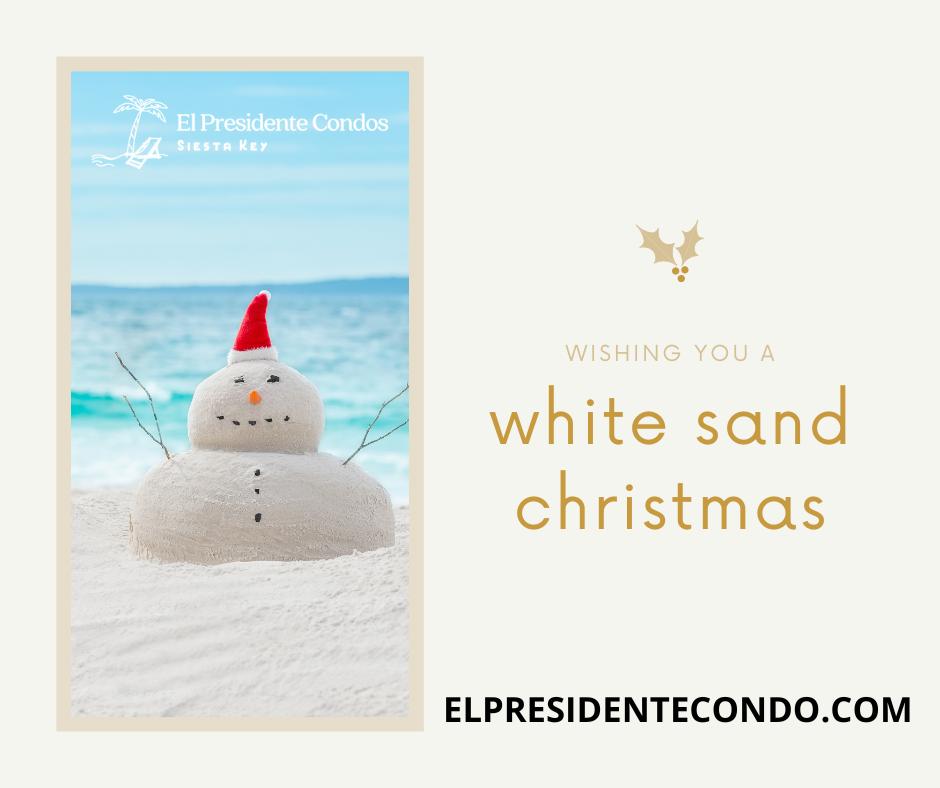 A white sand christmas card with a snowman on the beach.